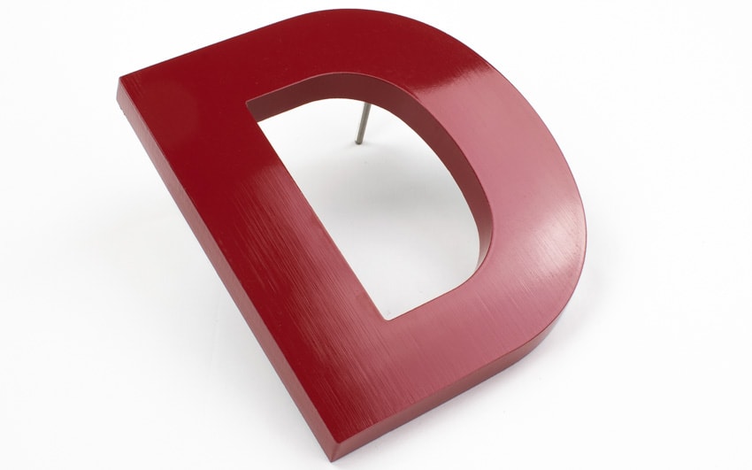 painted cast aluminum letter example in red helvetica font style