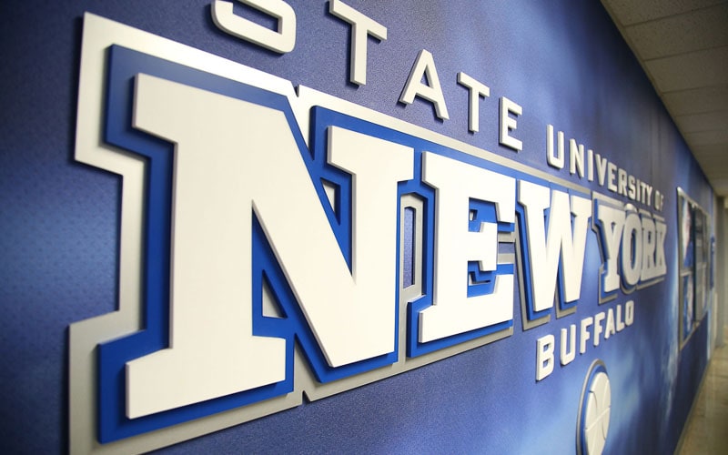 white interior letter sign on blue wall