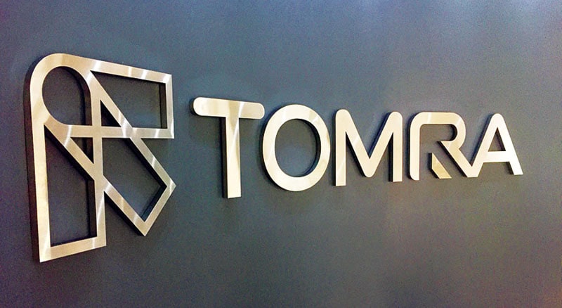 bruahed stainless metal on foam letter sign on black interior wall