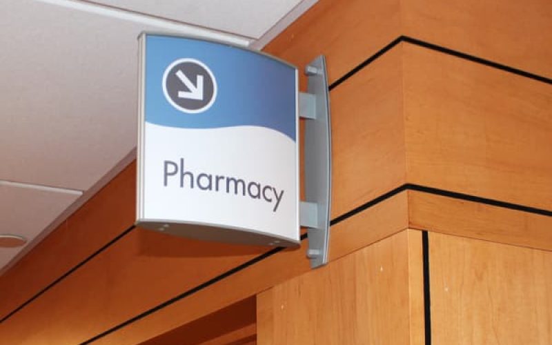 curved-projecting-sign-silver-pharmacy.jpg